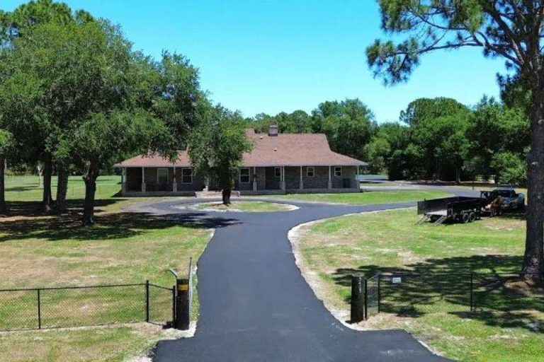 Newly paved curved asphalt driveway