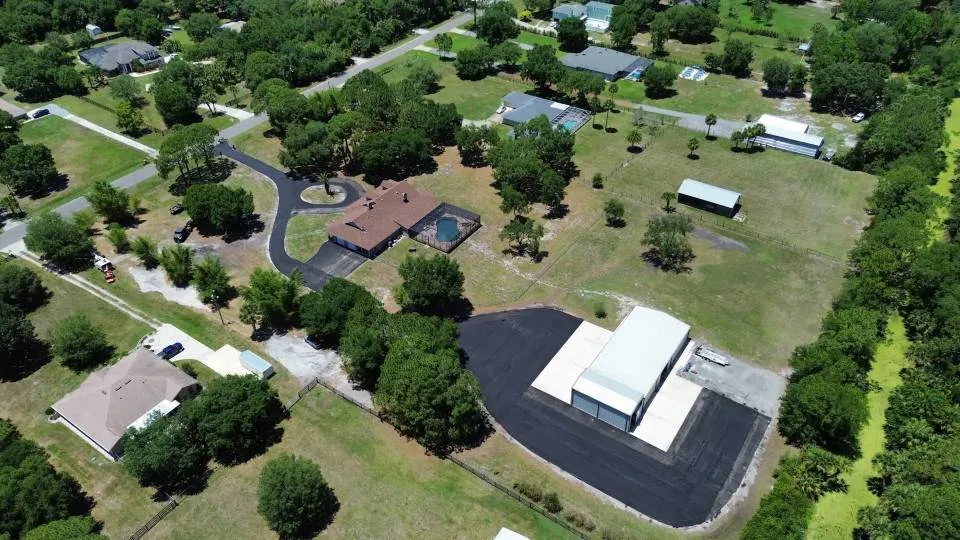 Aerial view of a newly paved commercial parking lot in Brevard County